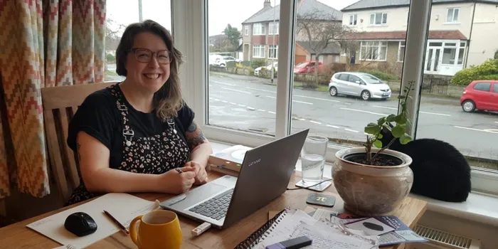 Student sitting at desk with laptop
