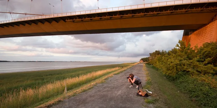 Photographer shooting from the banks of the river 