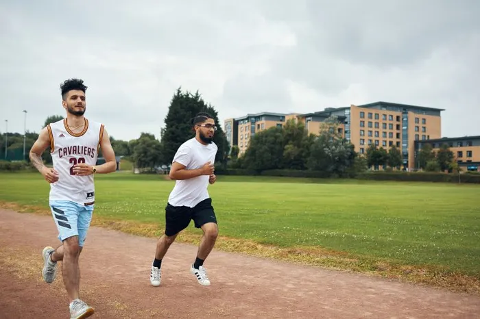 Image of students on the running track.