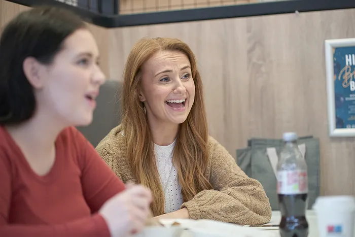 Two students sat at a table and talking in LTSU Trini-tea Central.