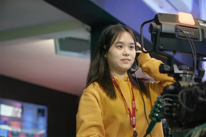 Student controlling a broadcasting camera in the Media Centre