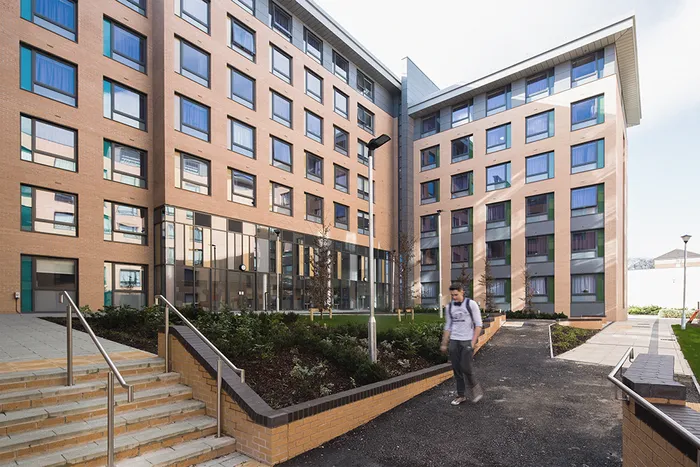 student walks outside Fountains Court