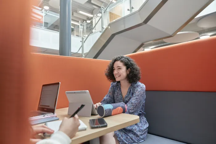 Student studying in Andrew Kean Learning Centre with laptop.