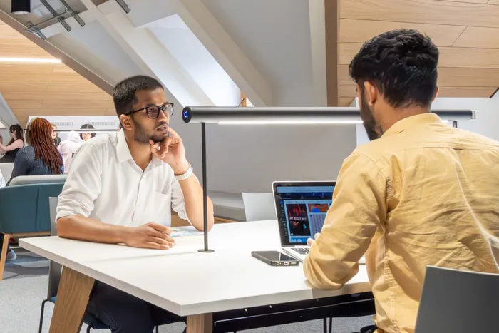 Students working in Leeds City Campus Social Space