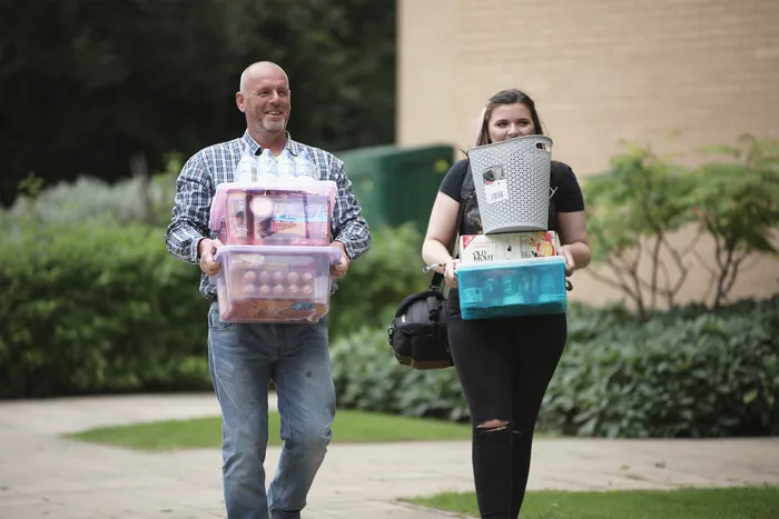 Parent/guardian helps new student move in to accommodation