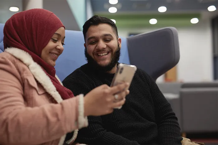 Two students using phone