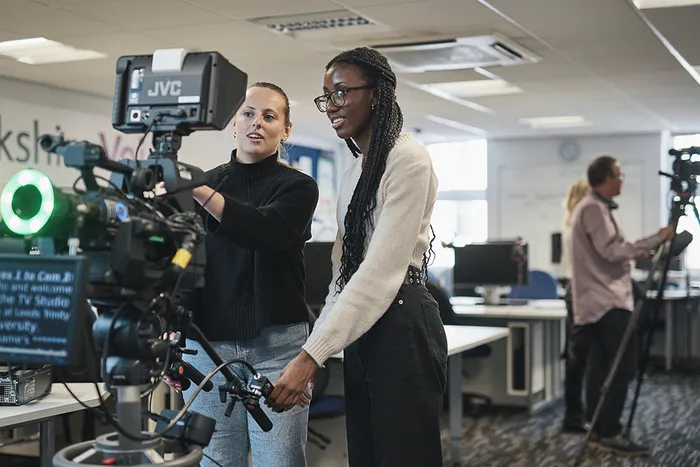 Two media students working with a camera