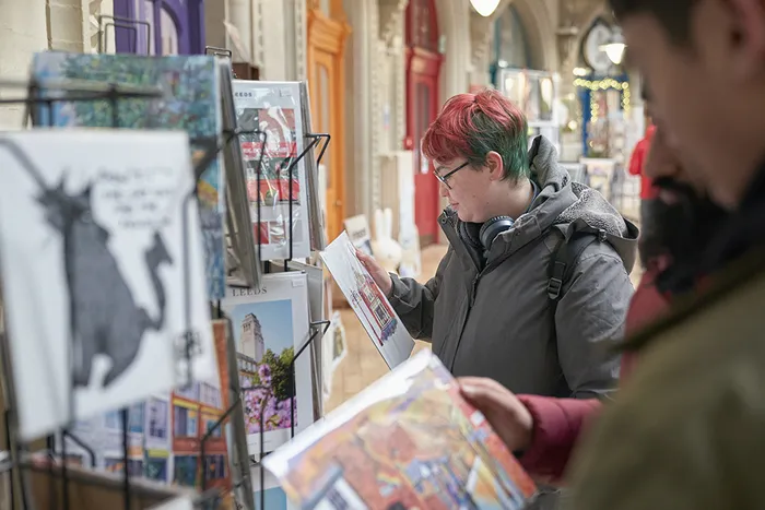 Student shopping in the Corn Exchange, Leeds
