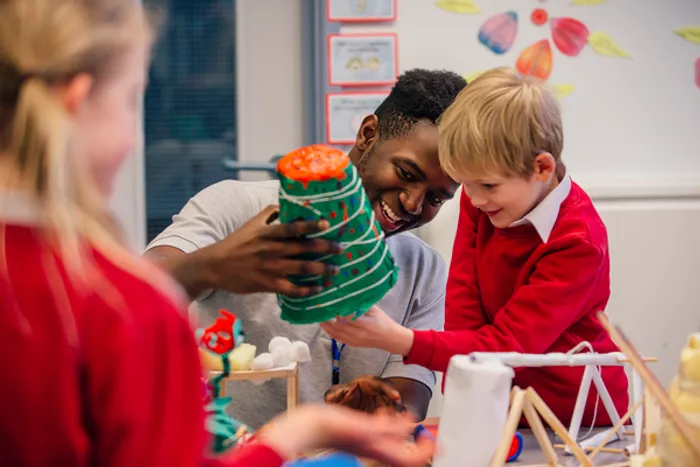 Image of a Primary Education student working with a pupil.